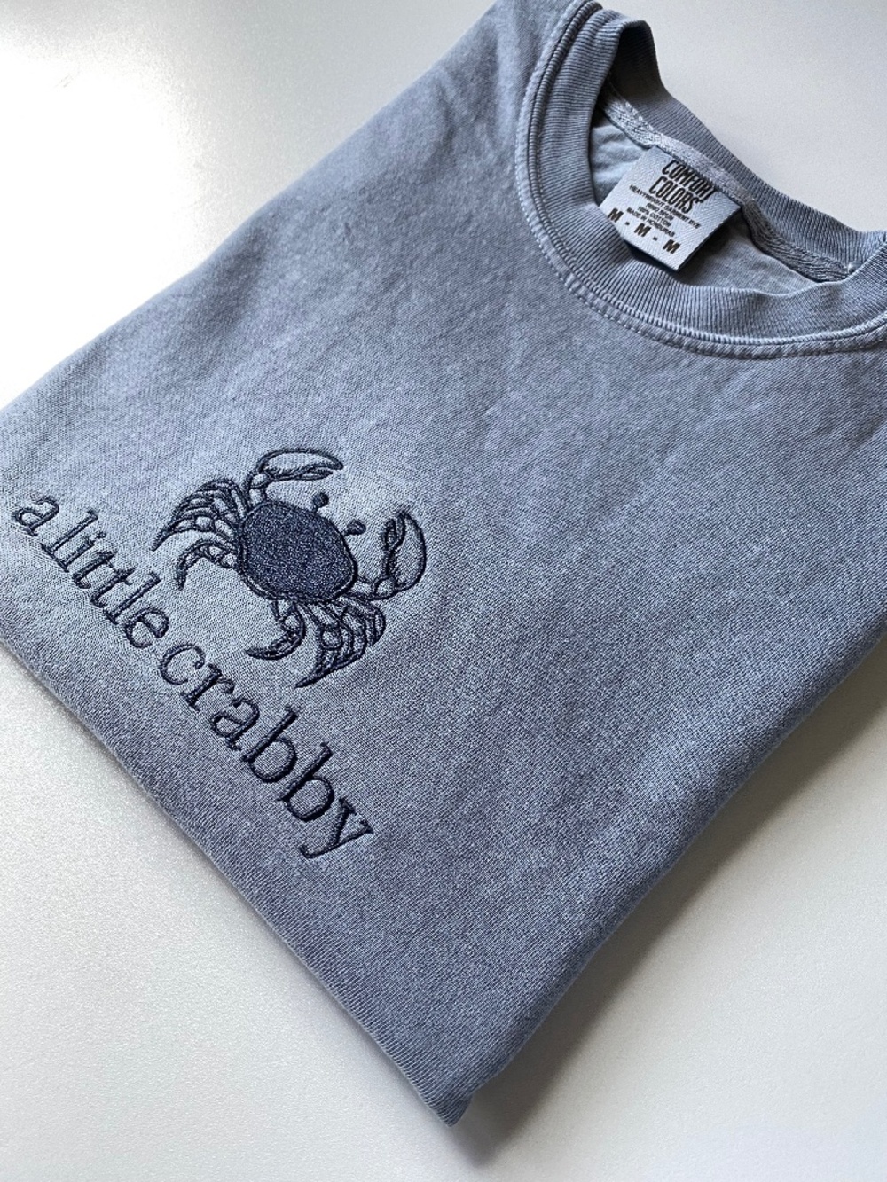Embroidered coastal crab design